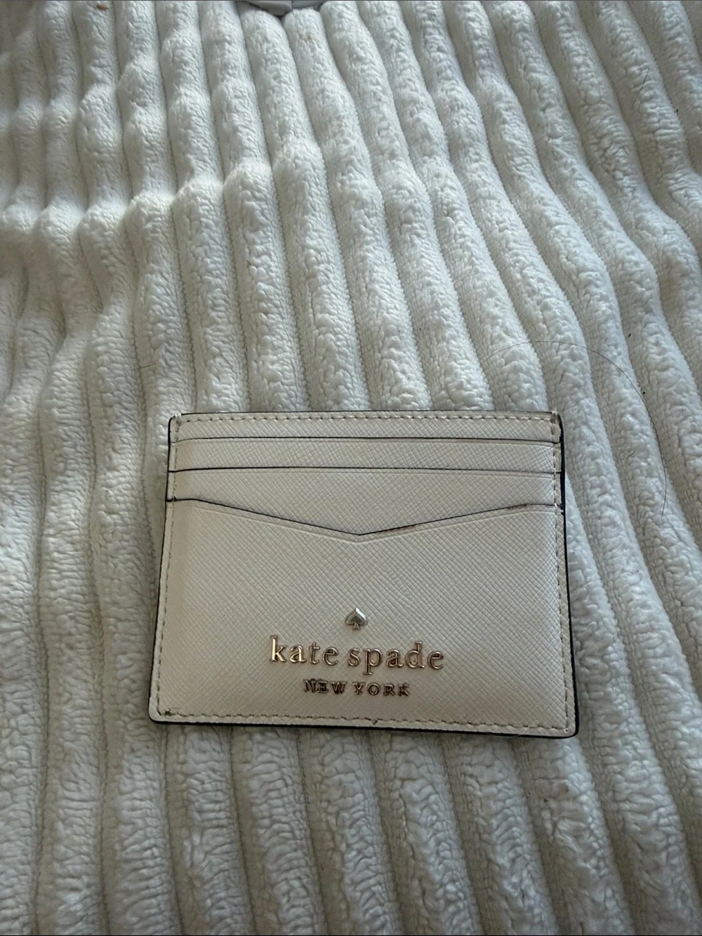 kate spade cream leather card case with gold logo
